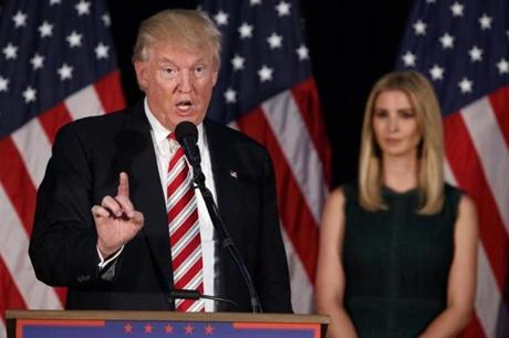 Ivanka Trump right watches as her father Republican presidential candidate Donald Trump delivers a policy speech on child care Tuesday Sept. 13 2016 in Aston Penn