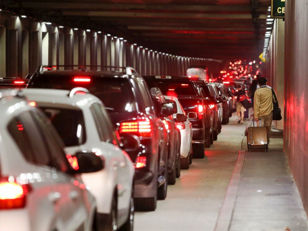 AP Passengers pull their luggage and walk toward Los Angeles International Airport Sunday Aug. 28 2016