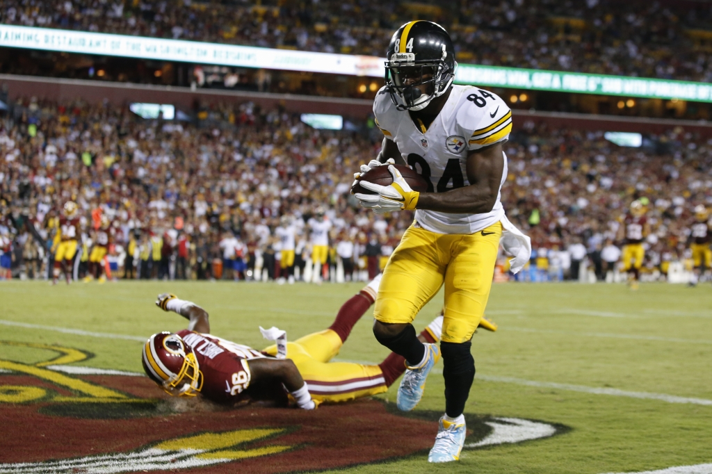 Washington Redskins cornerback Bashaud Breeland lands on the turf as Pittsburgh Steelers wide receiver Antonio Brown scores a touchdown during the second half of an NFL football game in Landover Md. Monday Sept. 12 2016. (AP