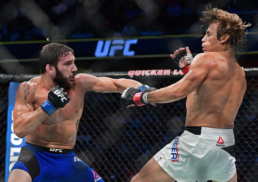 Jimmie Rivera left punches Urijah Faber during a bantamweight bout at UFC 203 on Saturday Sept. 10 2016 in Cleveland