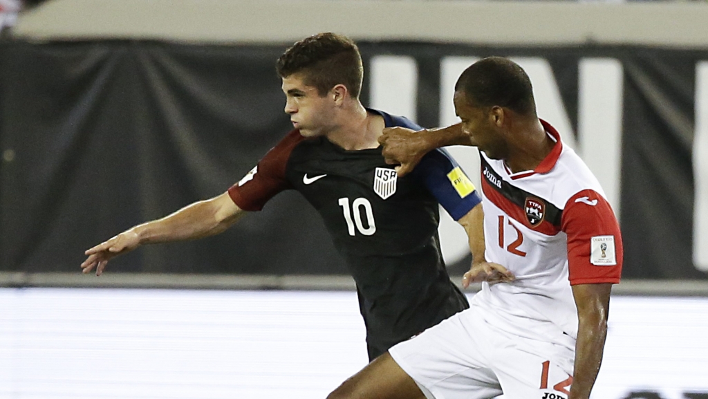 United States&#039 Christian Pulisic and Trinidad & Tobago's Carlyle Mitchell battle for the ball during the first half of a CONCACAF World Cup qualifying soccer match Tuesday Sept. 6 2016 in Jacksonville Fla