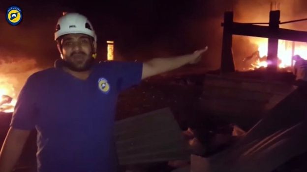 In this grab taken from video provided by the Syrian Civil Defence White Helmets a member of the team describes the damage after an airstrike in Aleppo Syria on 19 September