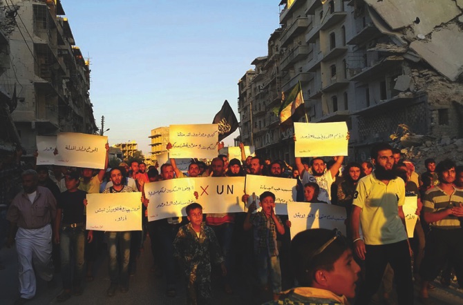 Activists in Syria’s besieged Aleppo protest against the United Nations for what they say is its failure to lift the siege off their rebel-held area