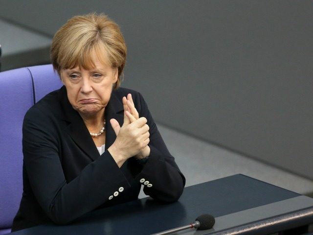 BERLIN GERMANY- JULY 03 German Chancellor Angela Merkel attends a meeting of the Bundestag Germany's federal parliament about a vote on exceptions to the minimum wage law to take effect from next year