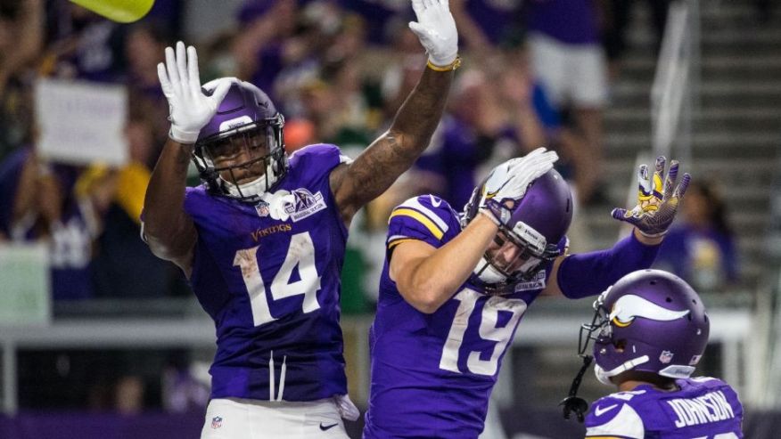 Minnesota Vikings wide receiver Stefon Diggs celebrates his touchdown with wide receiver Adam Thielen during the third quarter against the Green Bay Packers