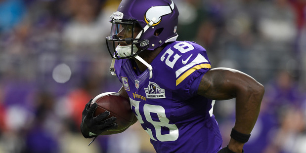 Adrian Peterson warms up prior to a game against the Green Bay Packers