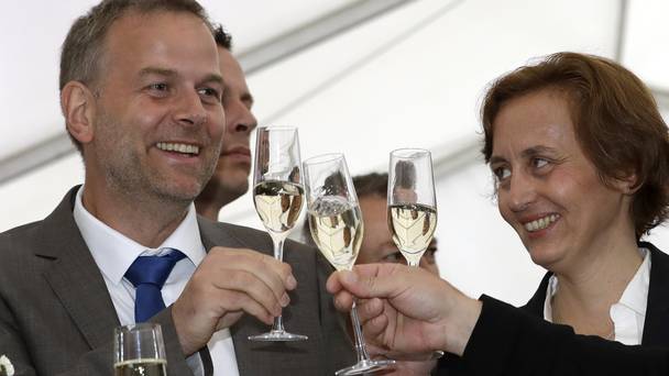 AfD candidate Leif Erik Holm and member Beatrix von Storch toast the party's success in Schwerin