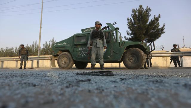 Afghan security forces stand guard after an attack on the American University of Afghanistan in Kabul Afghanistan