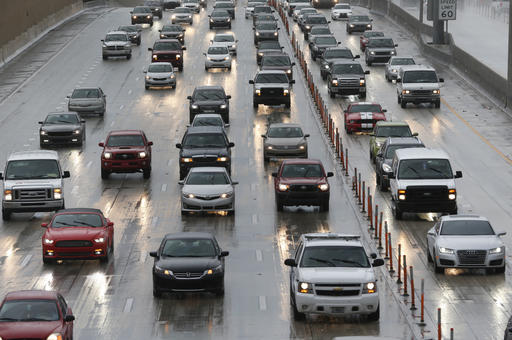 Drivers make their way in the rain along Interstate 95 Tuesday Aug. 30 2016 in Miami. Forecasters at the National Hurricane Center in Miami say a tropical depression in the Gulf of Mexico could hit northern Florida as a tropical storm later in the wee