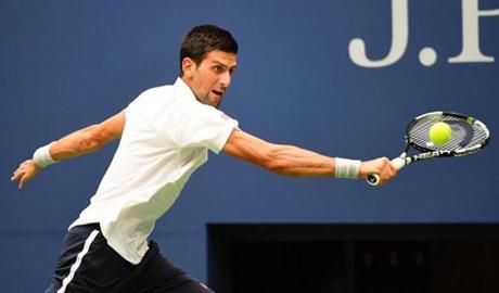 NEW YORK NY- SEPTEMBER 09 Novak Djokovic of Serbia returns a shot to Gael Monfils of France during their MenÂ’s Singles Semifinal Match on Day Twelve of the 2016 US Open at the USTA Billie Jean King National Tennis Center