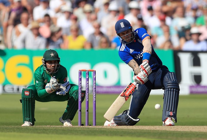 England's Alex Hales right bats as Pakistan wicketkeeper Sarfraz Ahmed looks on during the third one day international cricket match at Trent Bridge Nottingham England Tuesday Aug. 30