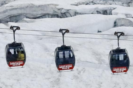 Dozens trapped in cable cars suspended over French Alps