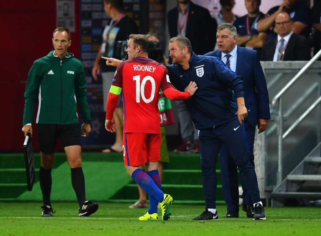 TRNAVA SLOVAKIA- SEPTEMBER 04 Martyn Margetson goalkeeping coach of England and Sam Allardyce manager of England give instructions to Wayne Rooney of England during the 2018 FIFA World Cup Group F qualifying match between Slovakia and England at City A