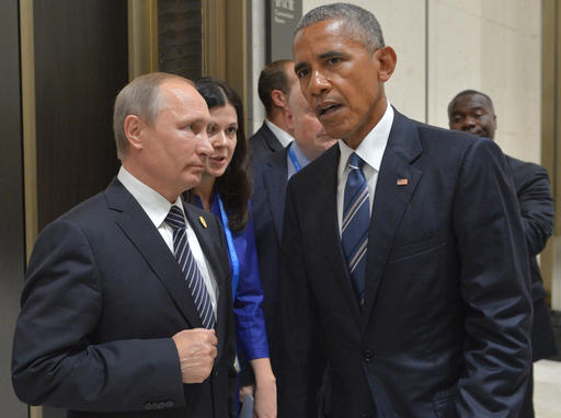 Russian President Vladimir Putin left listens to U.S. President Barack Obama in Hangzhou in eastern China's Zhejiang province Monday Sept. 5 2016