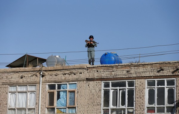 An Afghan policeman keeps watch near the site of a suicide attack in Kabul Afghanistan on 5 September 2016