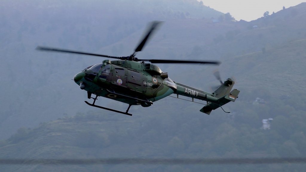 An Army chopper at surveillance during a militant attack at the army nrigade camp in Uri Jammu and Kashmir on Sunday. Credit PTI