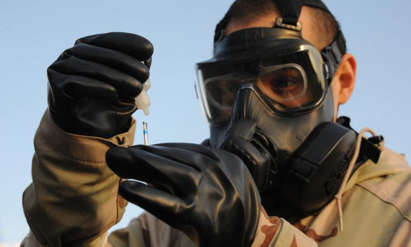 An airman tests water for chemical agents during an exercise. David Murphy  U.S. Air Force