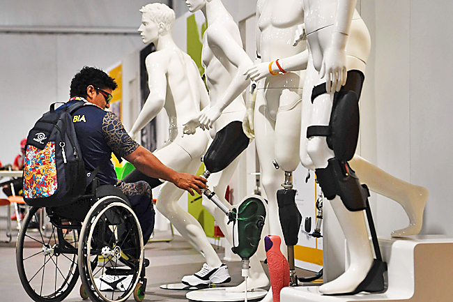 An athlete checks new arrivals at the Ottobock workshop in charge of reparing prosthesis.- AFP