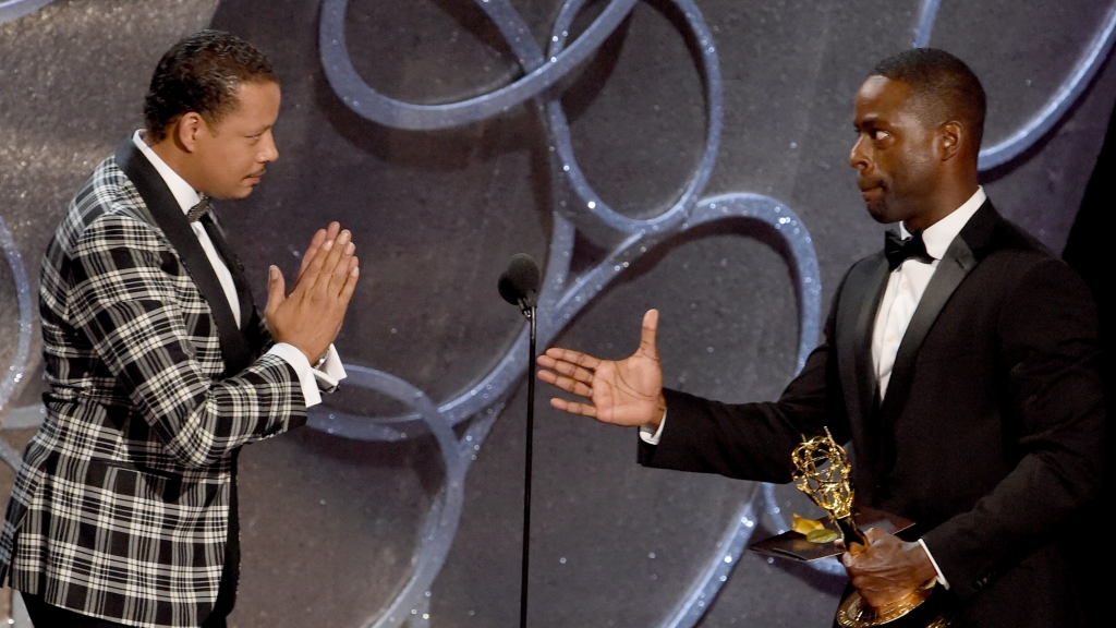 Actor Sterling K. Brown accepts Outstanding Supporting Actor in a Limited Series or Movie for'The People v. O.J. Simpson American Crime Story from Actor Terrence Howard during the 68th Emmy Awards show