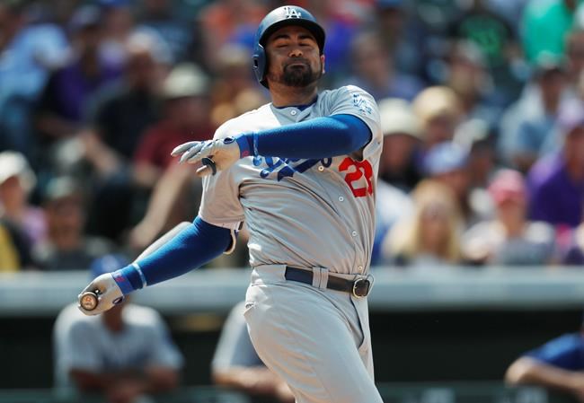 Los Angeles Dodgers&#39 Adrian Gonzalez strikes out on a pitch from Colorado Rockies starting pitcher Tyler Anderson with two runners on base in the sixth inning of game one of the first baseball game of a doubleheader Wednesday Aug. 31 2016 in Denver