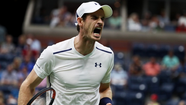 Andy Murray advanced at the U.S. Open amidst rainy conditions in Flushing N.Y