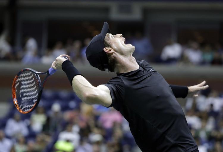 Andy Murray unleashes his killer serve on Grigor Dimitrov as he advances to the quarterfinals on Monday