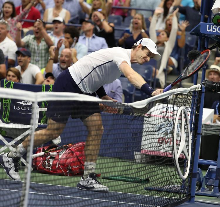 Andy Murray whacked his racket against the net in frustration during the U.S. Open quarterfinal loss