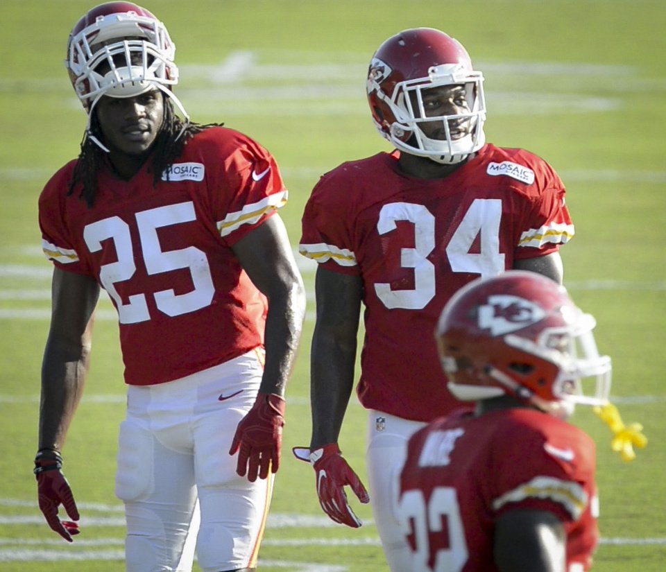 Chiefs running back Jamaal Charles talks with running back Knile Davis as Charles made a limited return to NFL football practice at the team's training camp Tuesday Aug. 16 2016 in St. Joseph Mo. (Monty Davis /The Ka