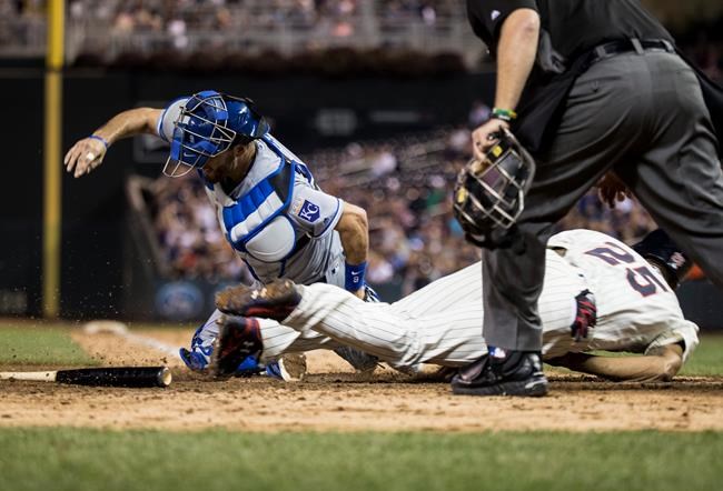 Minnesota Twins&#39 Byron Buxton slid safely into home against Kansas City Royals catcher Drew Butera left during the fifth inning of a baseball game Wednesday Sept. 7 2016 in Minneapolis