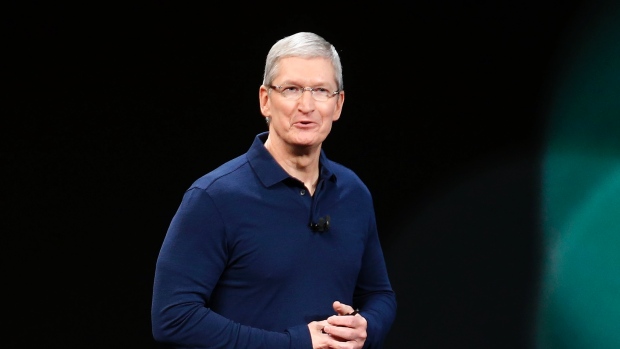 Apple CEO Tim Cook takes the stage during the announcement for the new Apple iPhone and other products in San Francisco today