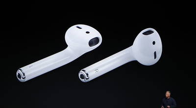 Apple Senior Vice President of Worldwide Marketing Phil Schiller announces Air Pods during a launch event