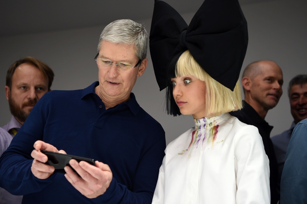 GettyImages-599947342 Apple CEO Tim Cook shows Pittsburgh dancer Maddie Ziegler of'Dance Mom's fame a new iPhone 7 on Wednesday at a product demonstration at Bill Graham Civic Auditorium in San Francisco. Pop singer Sia and Ziegler a dancer perfo