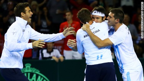 Leonardo Mayer of Argentina celebrates with his team-mates Juan Martin del Potro Guido Pella and Federico Delbonis after winning his deciding singles match against Dan Evans of Great Britain in Glasgow