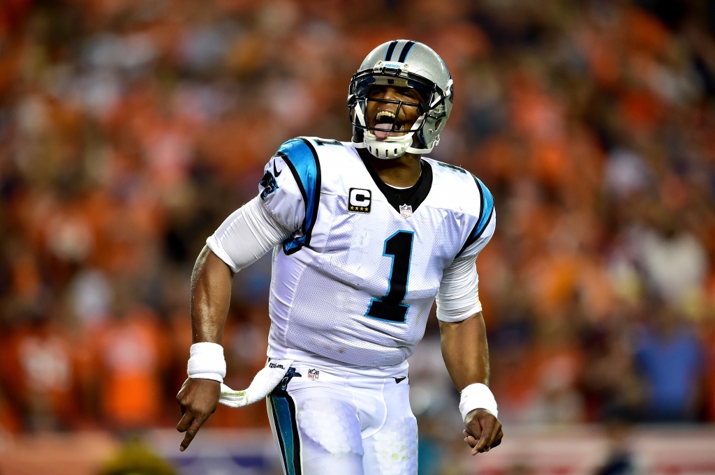 DENVER CO- SEPTEMBER 08 Quarterback Cam Newton #1 of the Carolina Panthers celebrates after scoring on a two-yard rushing touchdown in the second quarter against the Denver Broncos at Sports Authority Field at Mile High