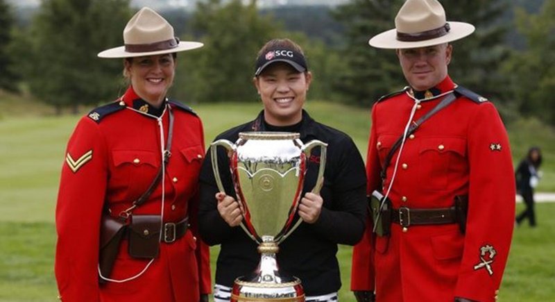 Champion Ariya and her Canadian Pacific Open trophy are well guarded by two members of the Royal Canadian Mounted Police famous world wide as the Mounties