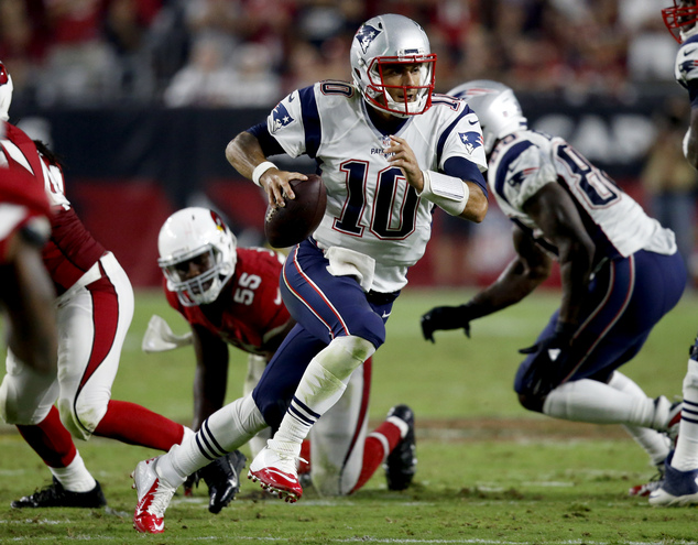 New England Patriots quarterback Jimmy Garoppolo scrambles against the Arizona Cardinals during the second half of an NFL football game Sunday Sept. 1