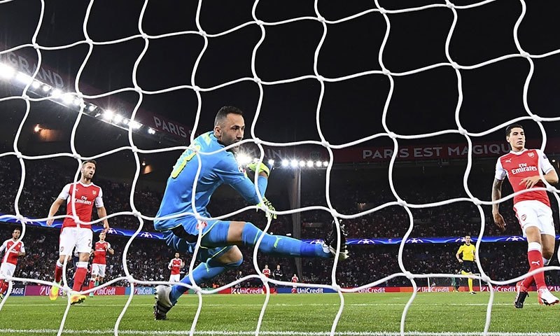 Arsenal's Colombian goalkeeper David Ospina tries to catch the ball. — AFP