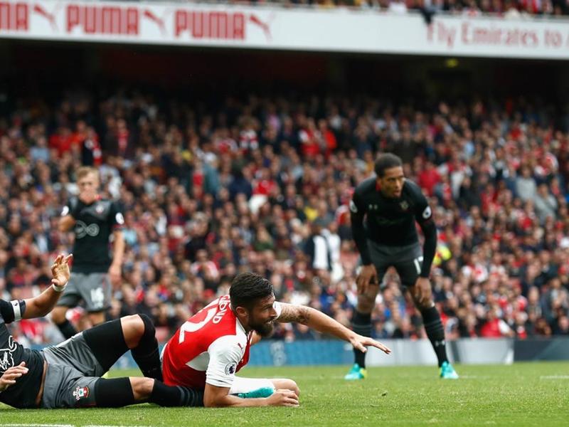 Arsenal striker Olivier Giroud goes down inside the area followed by a Santi Cazorla penalty to decide the game