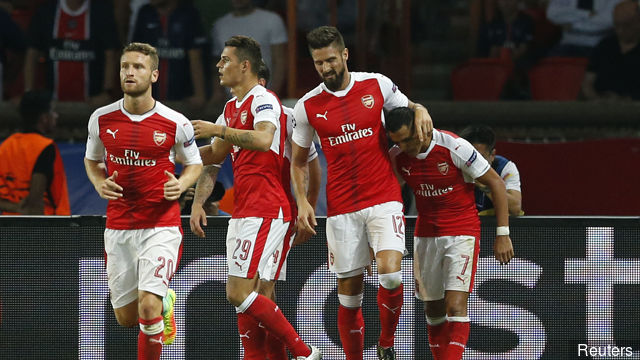 Arsenal's Alexis Sanchez celebrates scoring their first goal with team mates