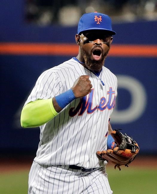 New York Mets third baseman Jose Reyes reacts after turning a double play with the bases loaded against the Philadelphia Phillies to end the top of the seventh inning of a baseball game Friday Sept. 23 2016 in New York