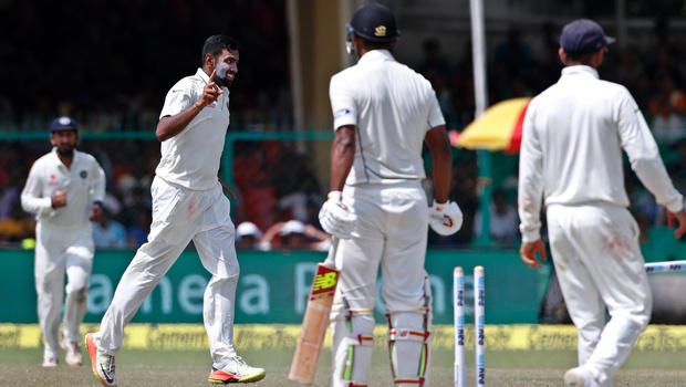 Indian cricketer Ravichandran Ashwin second left celebrates after claiming the wicket of New Zealand's Ish Sodhi second right on the fifth day of their first cricket test match at Green Park Stadium in Kanpur India Monday Sept. 26 2016. | AP