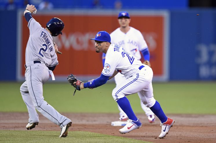 Devon Travis chases down Nick Franklin to get the first out of a double play in the second