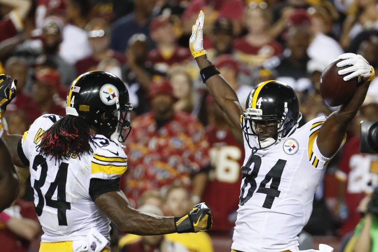 Steelers receiver Antonio Brown right enjoys his first-half TD catch with De Angelo Williams. Both players scored twice