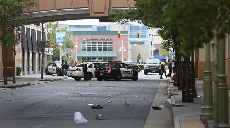 Police investigate the scene of a shooting on Saturday Sept. 3 2016 in Atlantic City N.J.  Authorities say a New Jersey police officer remains in critical condition after he was shot during an exchange of gunfire outside an Atlantic City casino. Acti