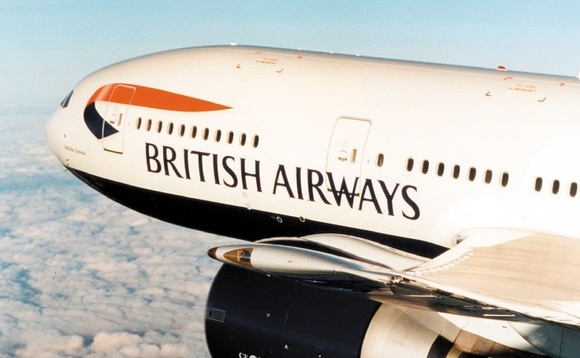 British Airways plane in flight against blue sky and clouds