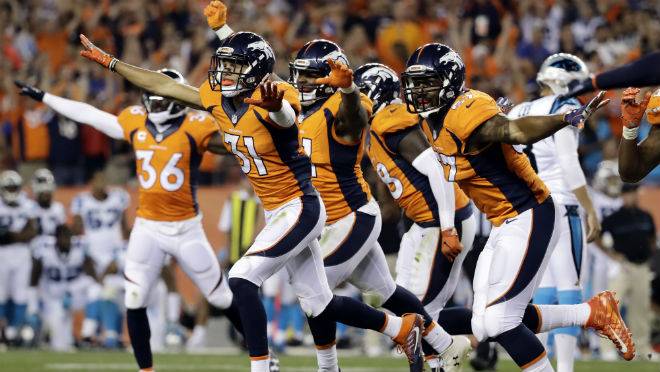 The Denver Broncos celebrate a missed game-winning field goal attempt by the Carolina Panthers during the second half of an NFL football game Thursday