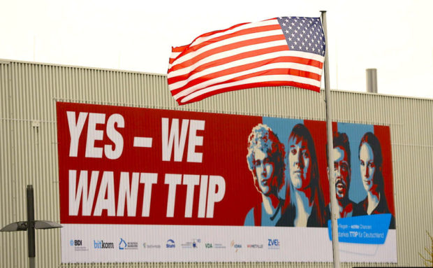 A large poster that reads 'Yes- we want TTIP&#039. Reuters