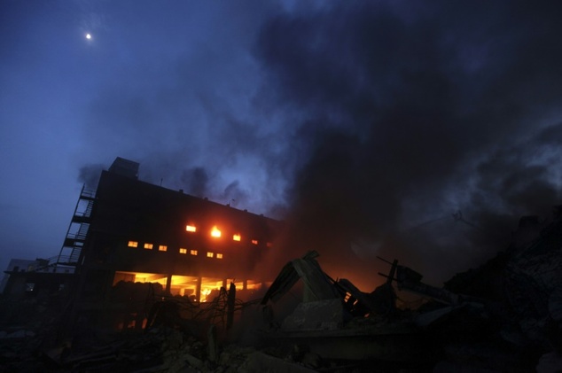 Smoke and flames billow from a burning factory in Tongi in the key Bangladeshi garment manufacturing hub of Gazipur on the outskirts of Dhaka on September