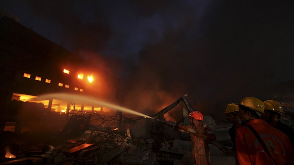 Bangladeshi firefighters work to put out a fire at the site of an explosion in a factory in Tongi in the key Bangladeshi garment manufacturing hub of Gazipur on the outskirts of Dhaka