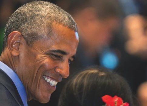 Barack Obama smiles after greeting Myanmar’s Foreign Minister Aung San Suu Kyi during the ASEAN-United States summit